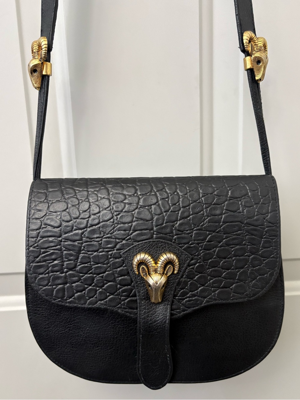 Black Leather Crossbody Bag with Gold Ram Head Accent